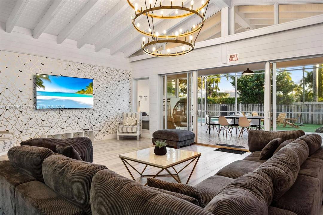 Stunning and elegant mid century estate nestled in the prestigious Hollywood Lakes neighborhood.