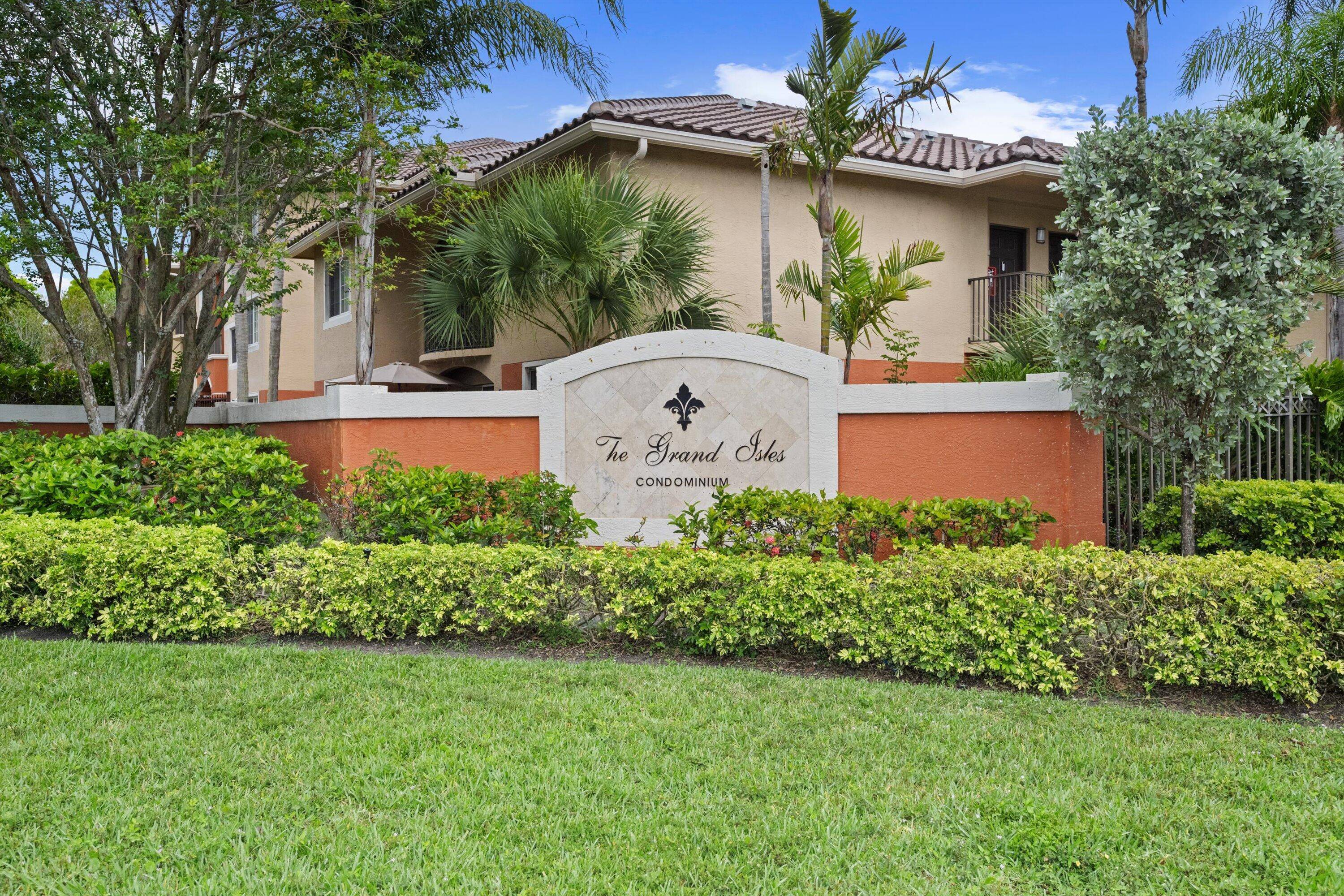 NEW ROOF 3 bedroom, 2 bath, lake view condo in the well maintained gated community of Grand Isles.