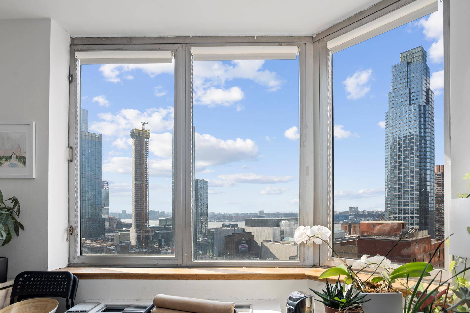 Sun Filled large studio with panoramic skyline and Hudson River views at the renowned Strand Condominium.