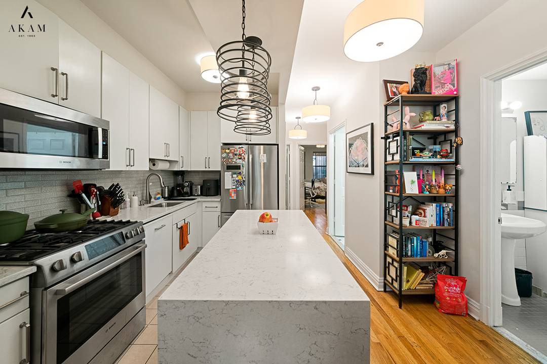 Located in a beautiful and historic, 1909 brownstone, this two bedroom, one and a half bath condominium effortlessly blends classic charm with modern comforts.