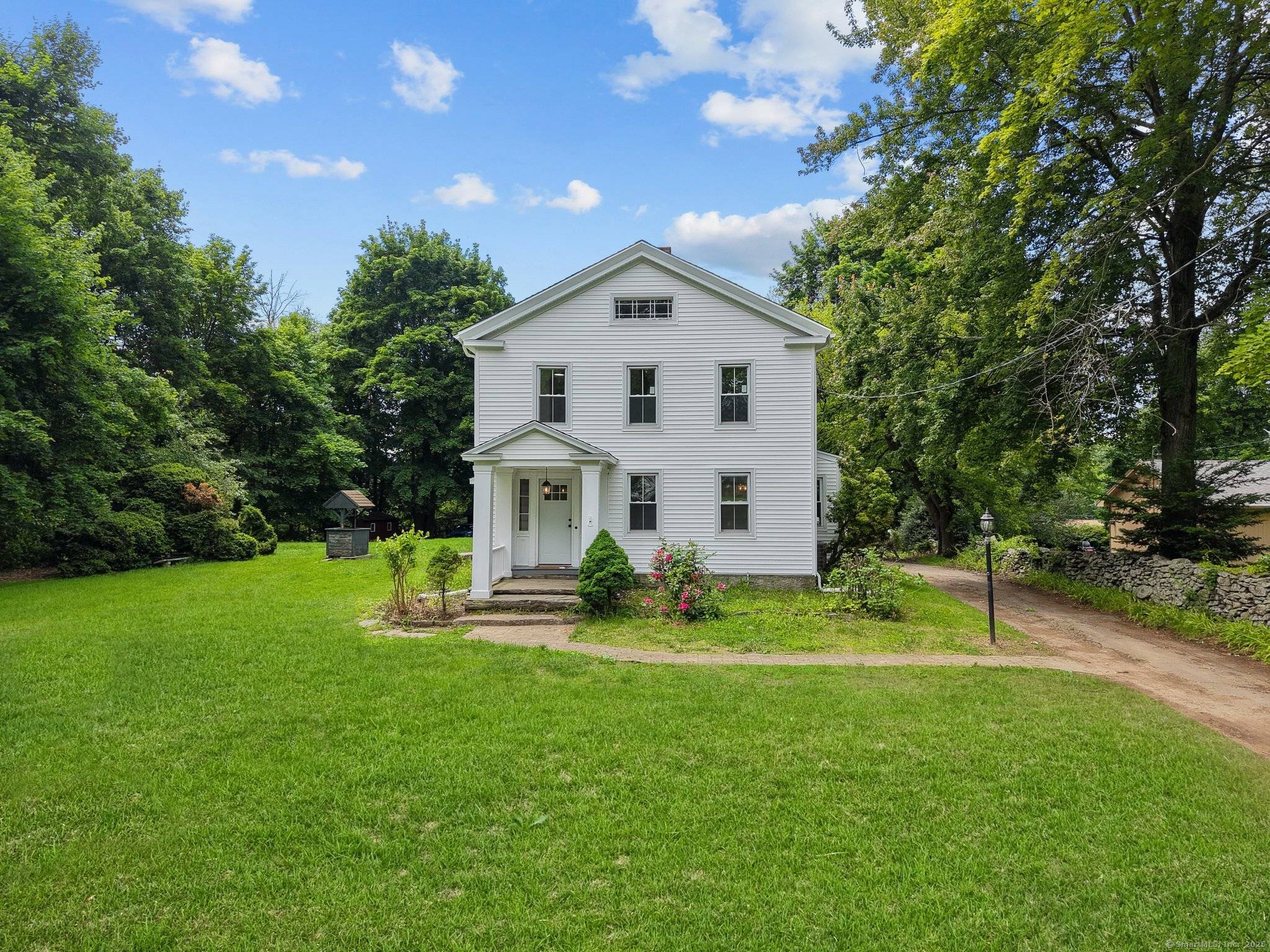 An updated antique colonial home which features 5 bedrooms and 2.