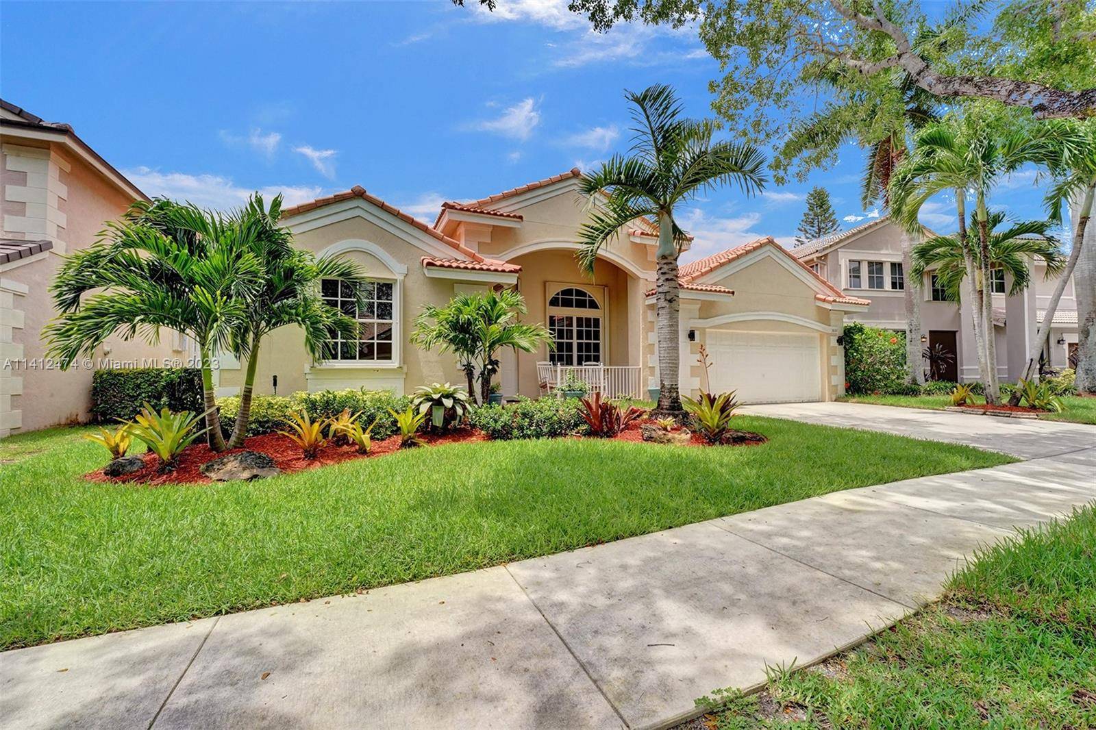 WELCOME HOME TO THE RIDGES, A HIGHLY DESIRABLE GATED COMMUNITY IN WESTON.