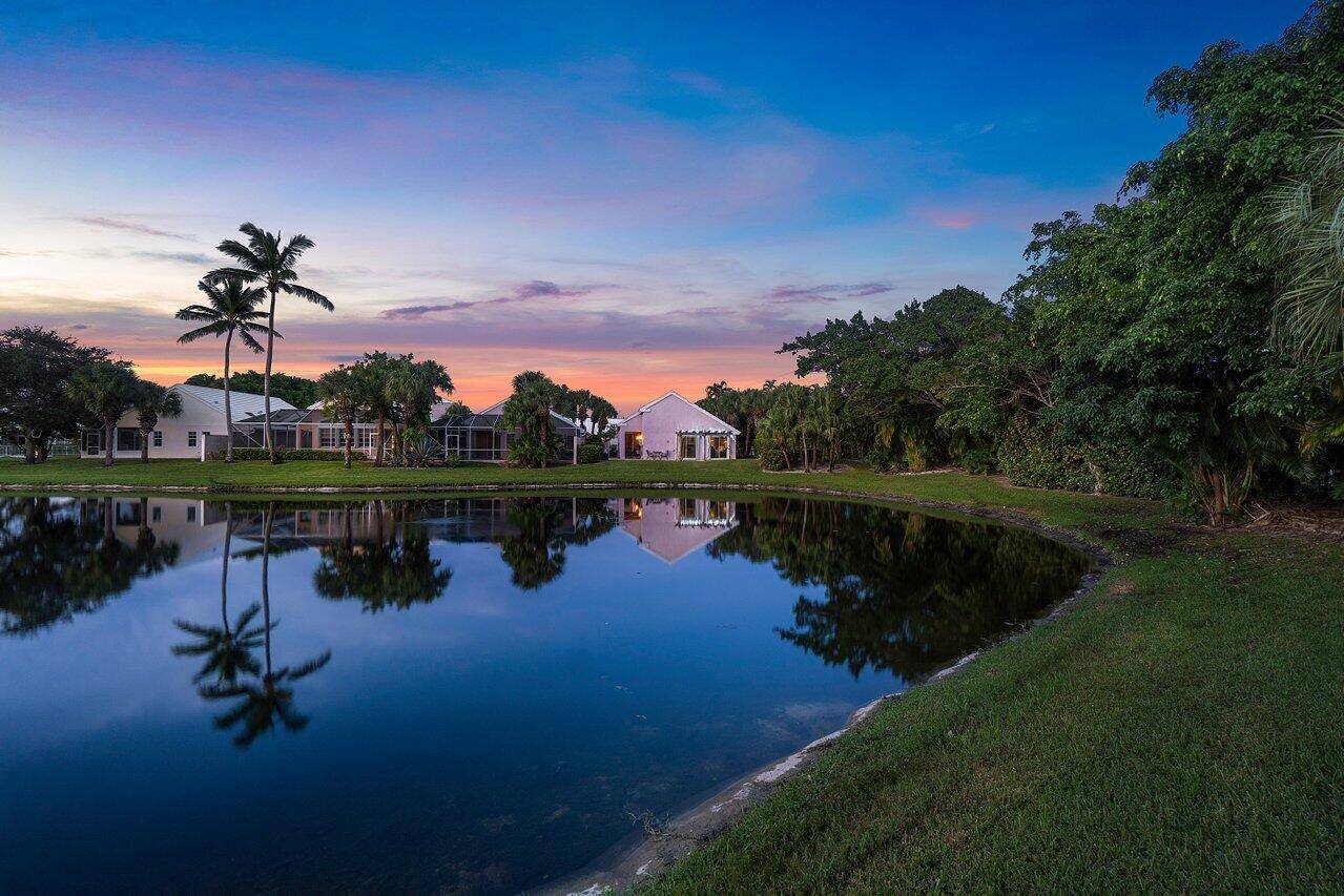 This beautifully designed one story home, nestled at the end of a cul de sac in the desirable Breakers West community, offers exceptional privacy and breathtaking lake views.