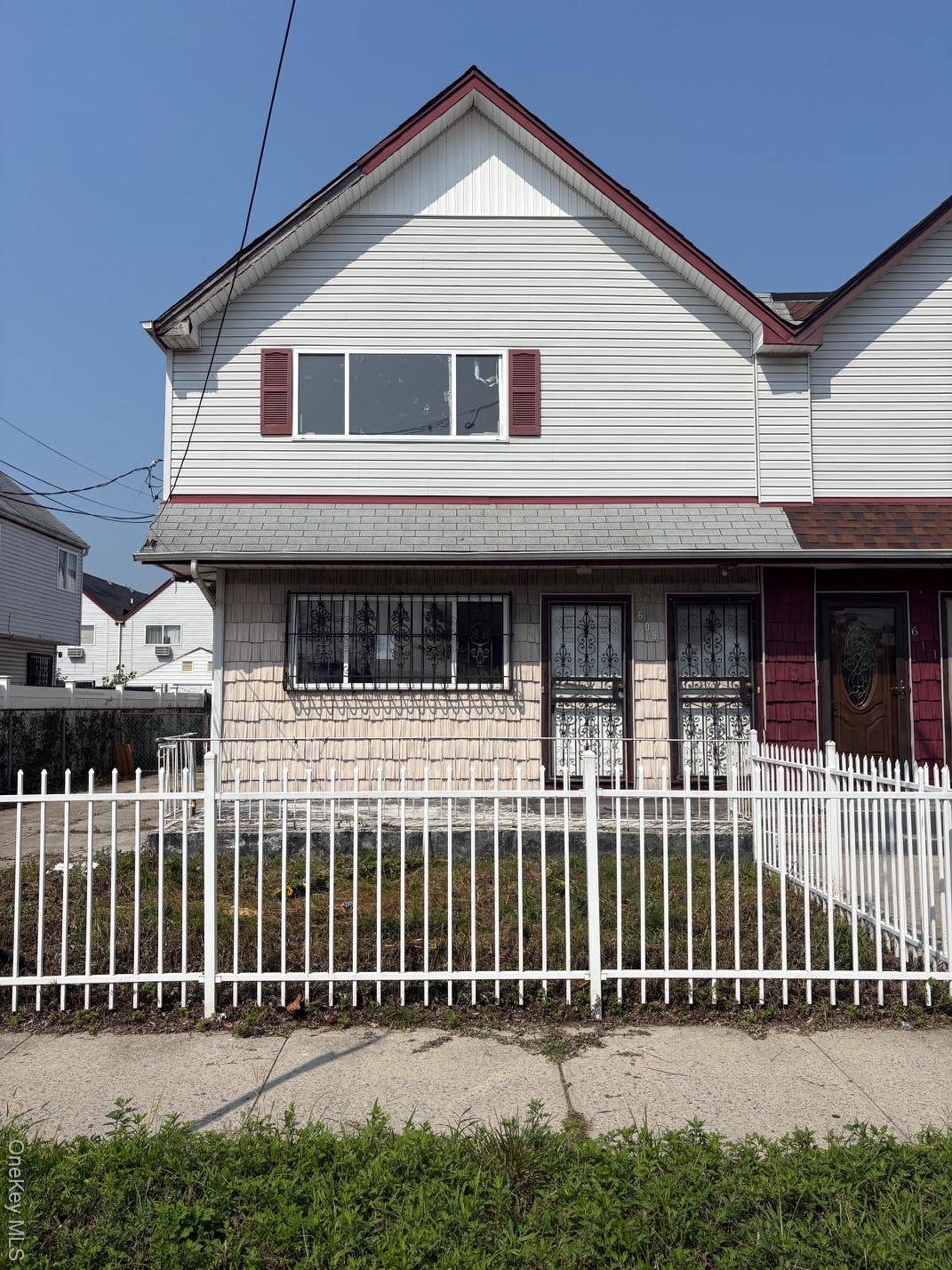 Large 2 family, 2 story semi detached frame house.