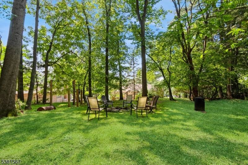 HALF ACRE in PRESTIGIOUS BROADLAWN with TONS of NATURAL LIGHT this CUSTOM BI LEVEL boasts 2600 sq ft of Living Space.