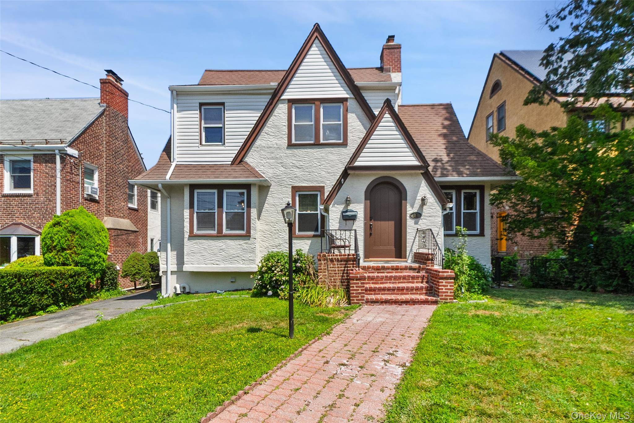 This charming 3 bedroom, 2 bathroom Tudor style home offers approximately 1, 950 square feet of functional living space and timeless character.