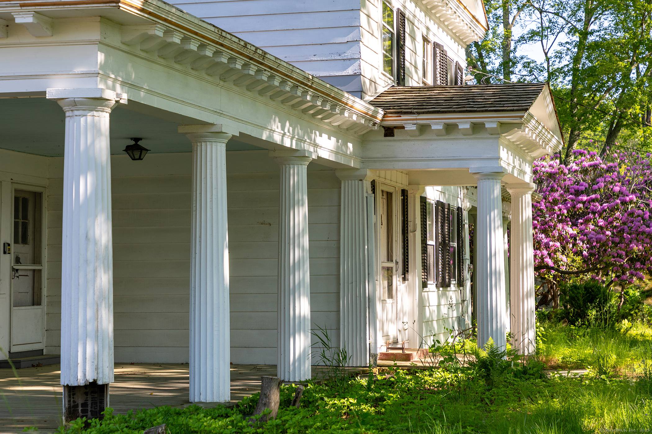 Greek Revival Splendor ! A structure of noble proportions architectural significance stands prominently at the center of this pastoral expanse.