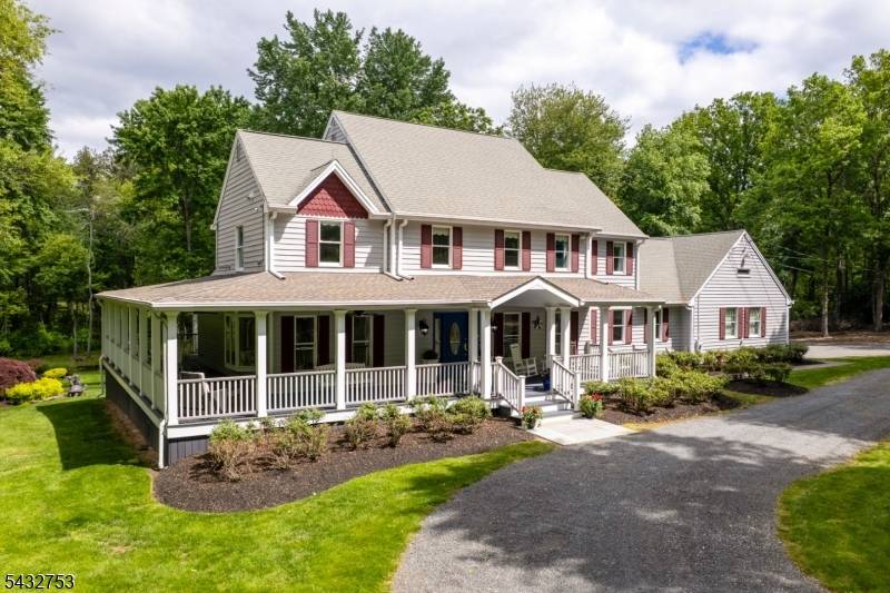 A breezy, wraparound porch sets the tone at The Turtle House, the centerpiece of an idyllic 6 acre property that revels in natural splendor.