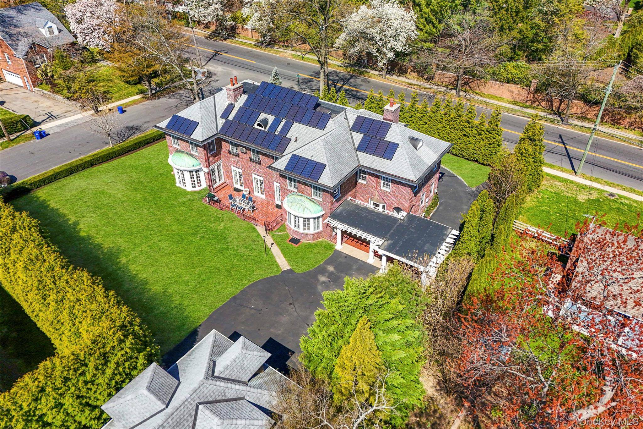This stately brick mansion features many unique and well preserved original 1911 classic architectural elements, while powered with a fully owned 10kW solar panel array !