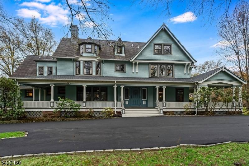 This stately Queen Anne Victorian makes an impression w timeless architectural detail, set on 1.