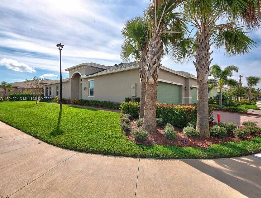 Get ready to own this elegantly kept 2 bedroom, 2 bath villa with 2 car garage situated on a corner lot.