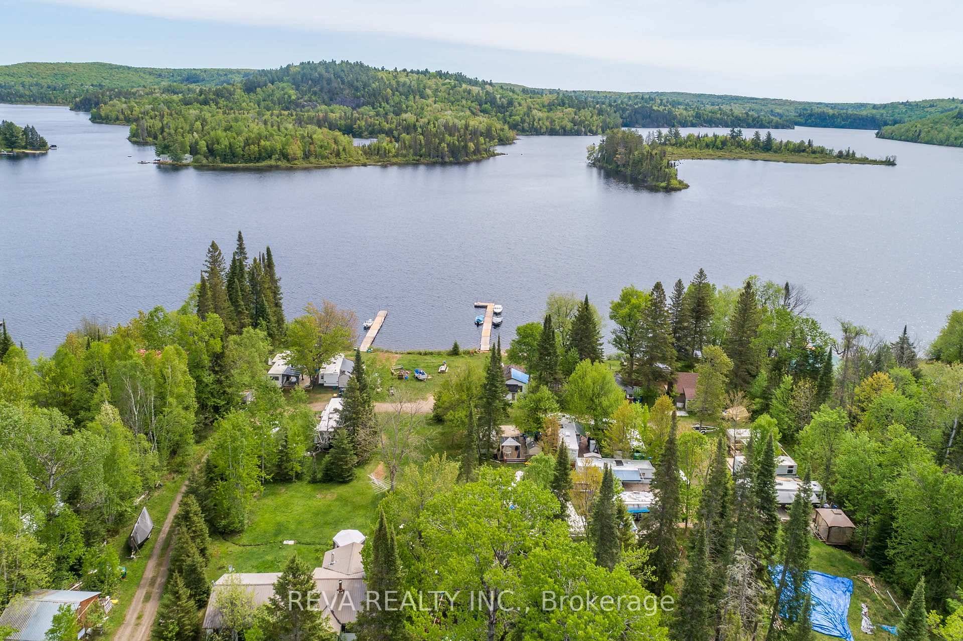Live, work and play at Baptiste Lake this property is a blend of Residential and Commercial use with 12 trailer sites, 3 cabins and a cottage home.