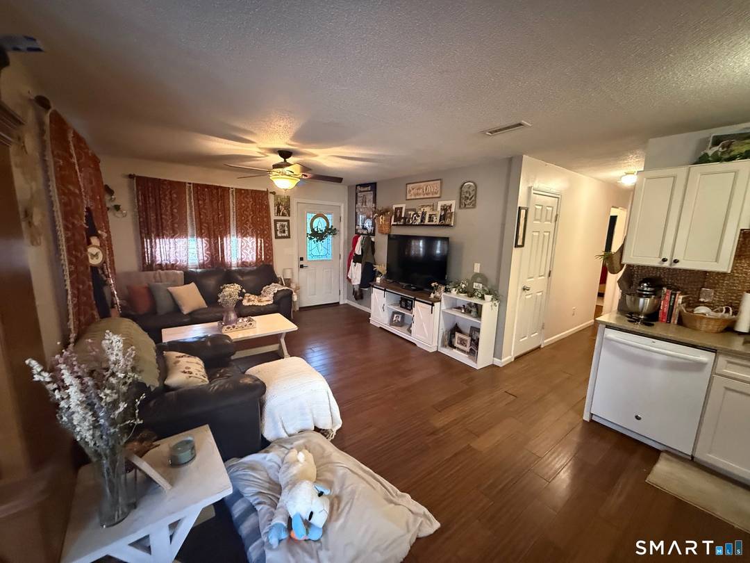This 5 BDR, 2 bath 1987 Colonial home offers a built in 4 room in law apt.