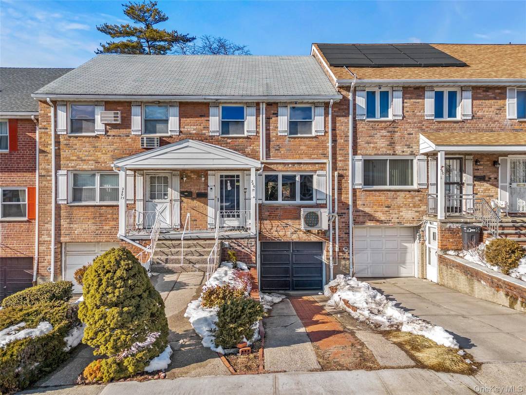 Sun filled, fully brick above ground 3 story single family with open front and rear exposure and desirable south facing orientation.