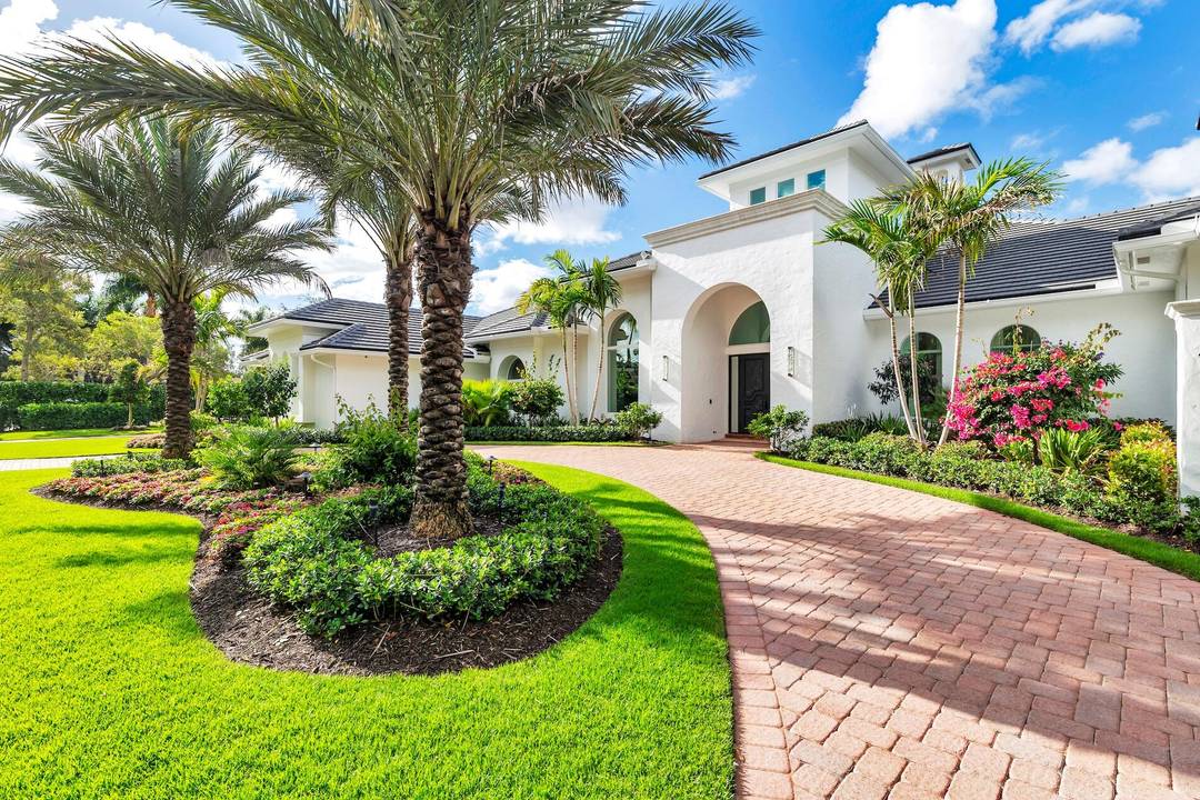 An extraordinary one level offering within the prestigious Palm Beach Polo Club, this impeccably reimagined estate embodies refined luxury and effortless sophistication.