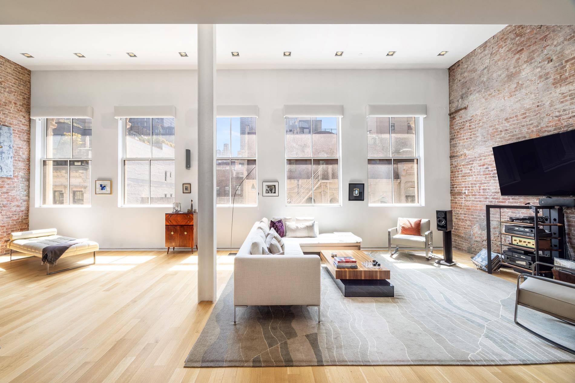 Welcome to the ultimate TriBeCa loft experience a sun drenched, floor through 3 bedroom, 2.