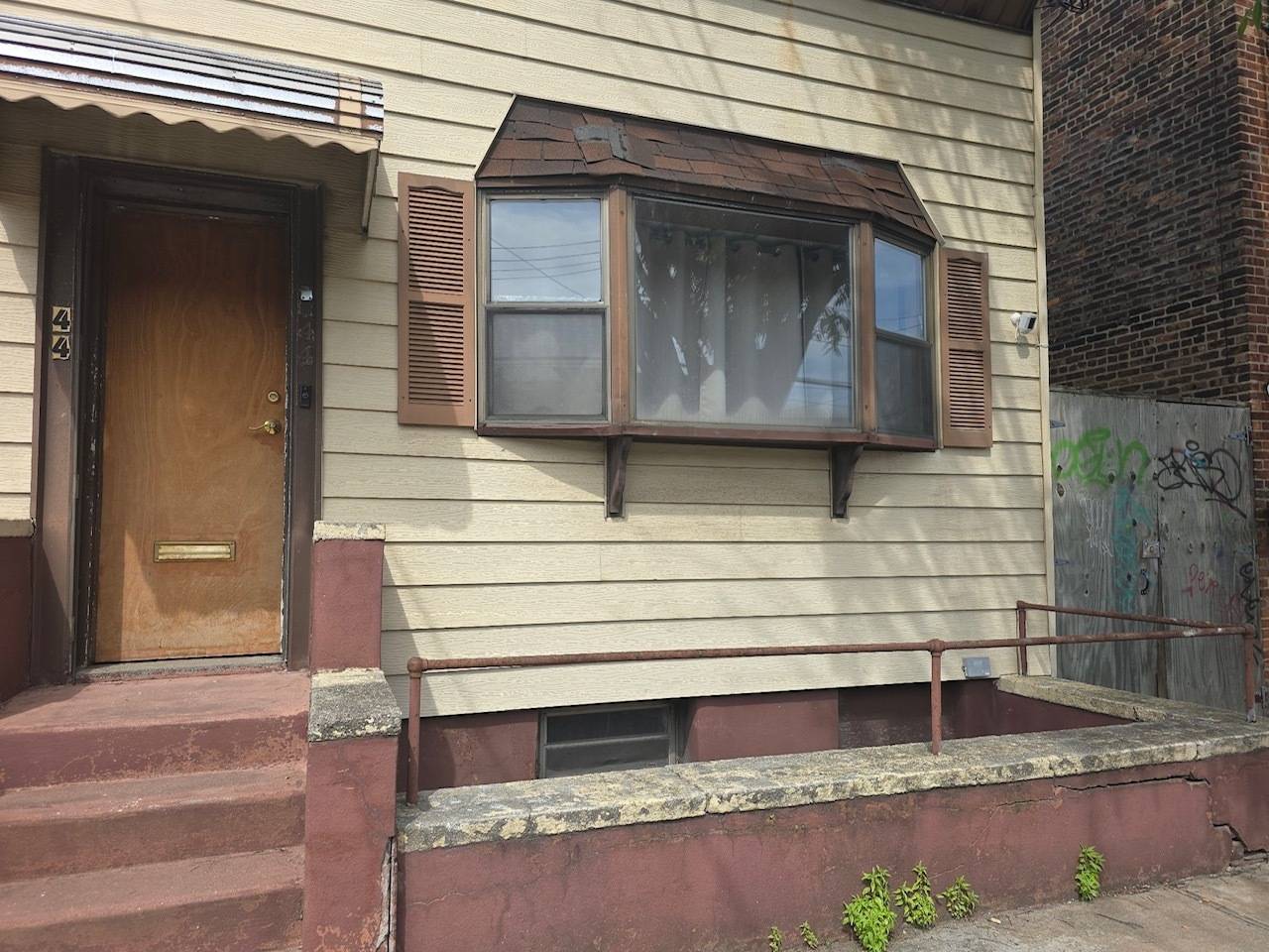 20x40 wood frame one family house on a 25x100 lot on an eclectic street in Red Hook, Brooklyn.