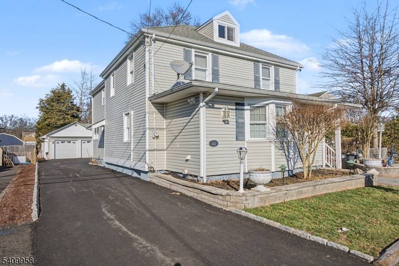 Welcome to this spacious 9 room Colonial, beautifully set on an manicured lot.