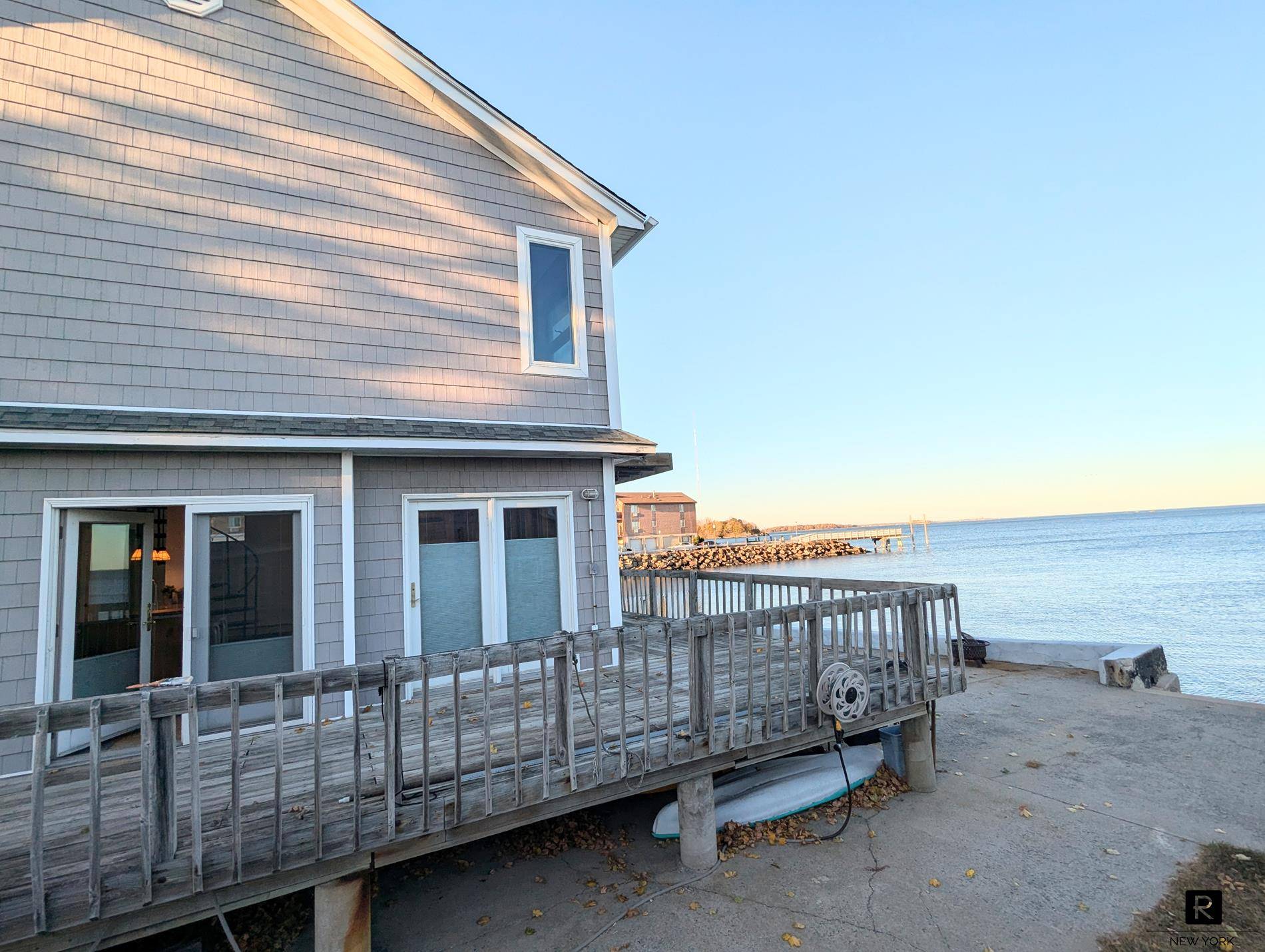 A once in a lifetime STUNNING WATERFRONT single family house rental positioned right on the water of a 3 homes property lot on the lovely City Island !