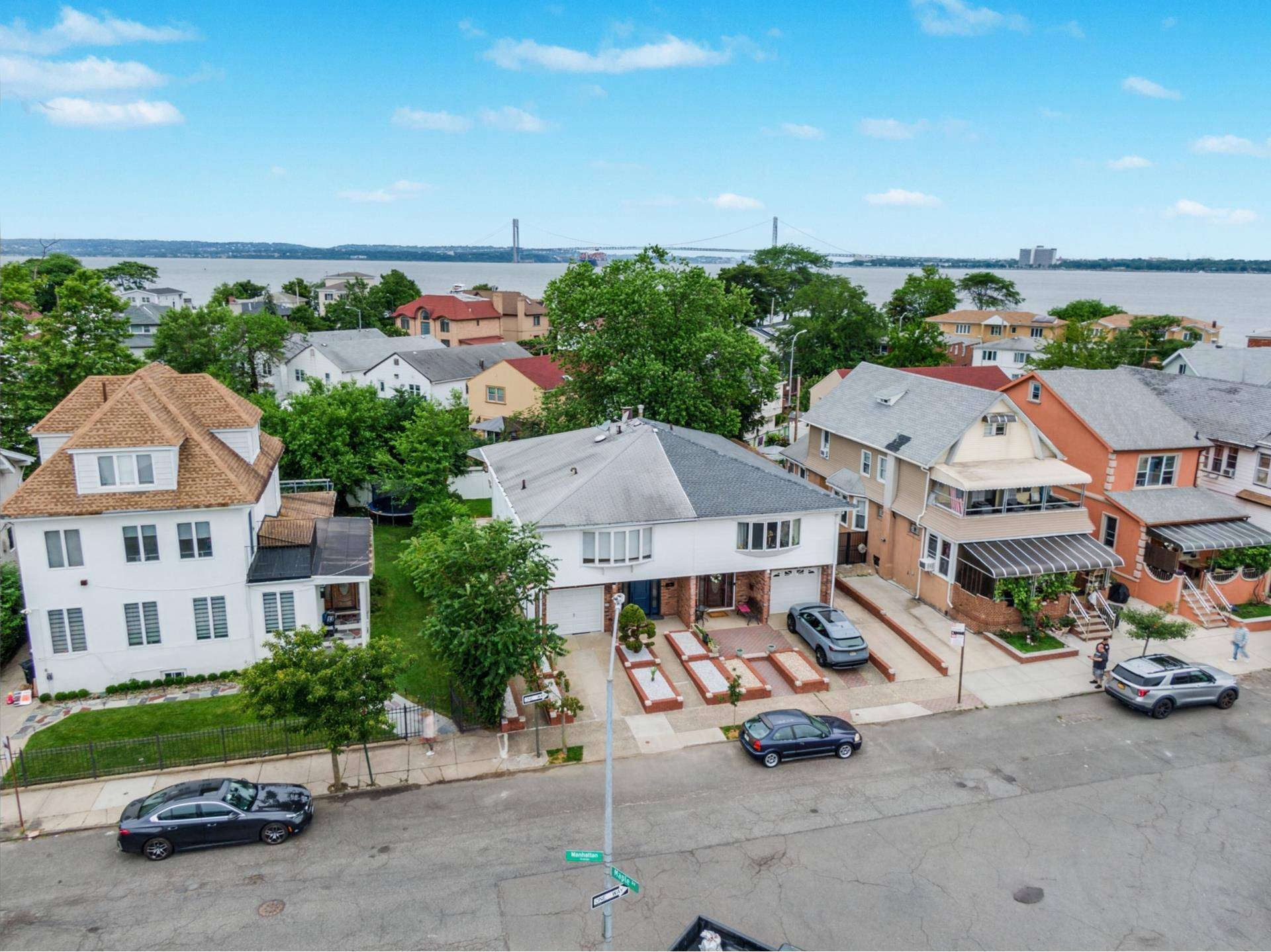 Welcome to a beautifully reimagined home in Brooklyn's exclusive, gated Seagate community.