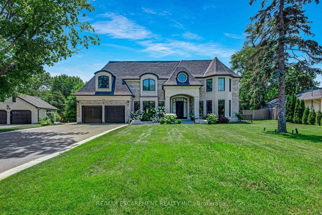 Set on a rare 172 ft wide pie shaped lot, this custom built French Cha teau estate offers approximately 10, 000 sq ft of refined living space, delivering exceptional scale, ...