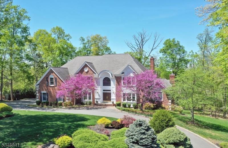 Nestled within Warren's most coveted and prestigious enclaves, this exquisite custom built, four sided brick colonial residence exudes timeless elegance on a meticulously landscaped parcel.