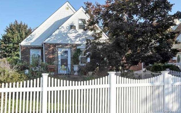 Spacious Cape Cod style Brick home on a quiet, tree lined street on a dead end block.