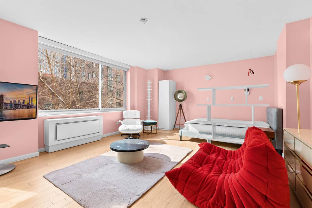 This furnished, oversized east facing studio is flooded with natural light and located in the heart of Battery Park City.