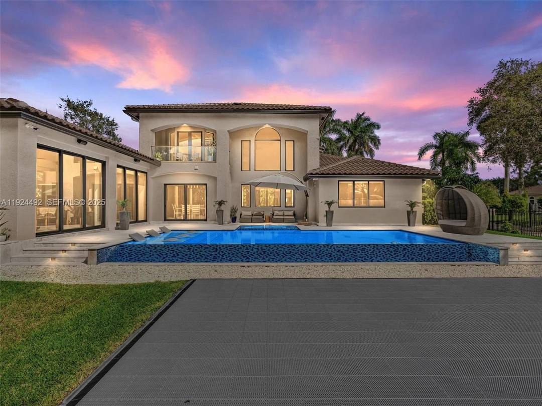 Discover this exquisite residence in the serene enclave of Plantation Acres.