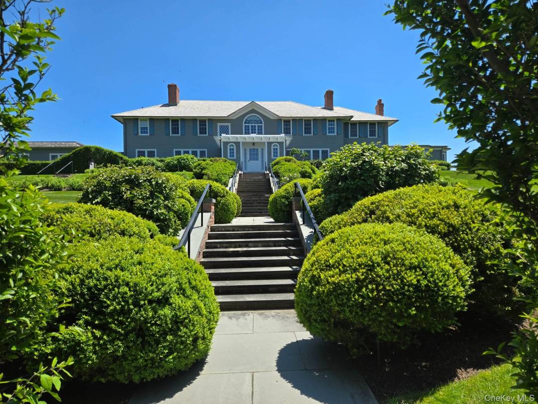 Perched atop one of the highest points on prestigious Lily Pond Lane, this exceptional oceanfront compound offers truly unduplicatable sweeping views of the Atlantic Ocean and expansive sandy beaches.