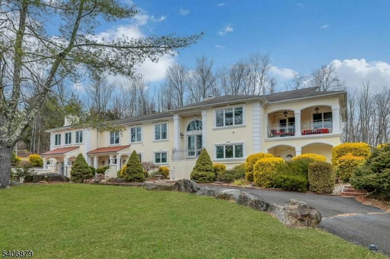 Situated on six private acres in the Historic Brookside section of Mendham, just minutes from Morristown and Mendham Borough, this expansive custom built home is set on a quiet cul ...