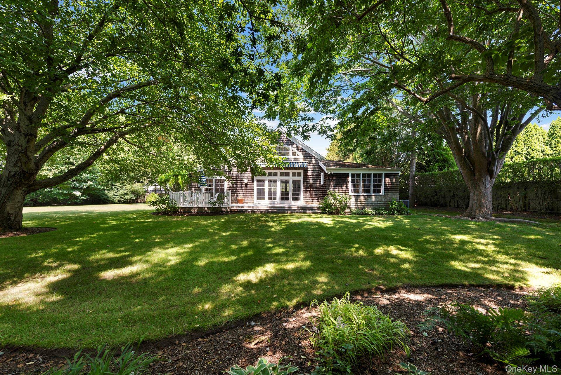 Perfectly positioned between the Amagansett Square and cherished Farmer's Market there exists a magical property, hidden south of the highway, just off Main Street.