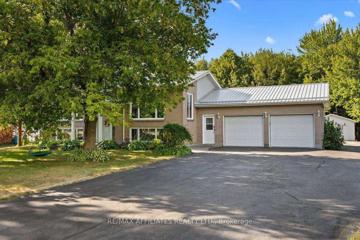 Welcome to this beautiful raised bungalow featuring four spacious bedrooms and an oversized double car garage.