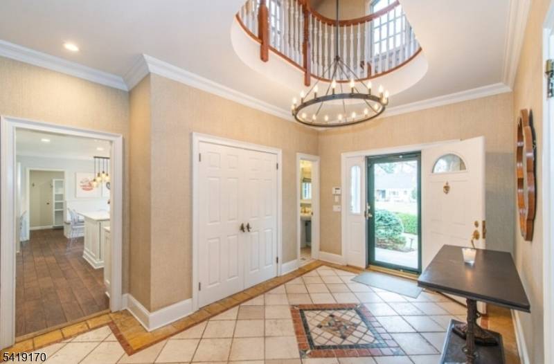 Spacious and well maintained custom expanded brick home located in the highly desirable Deerfield neighborhood of Short Hills.