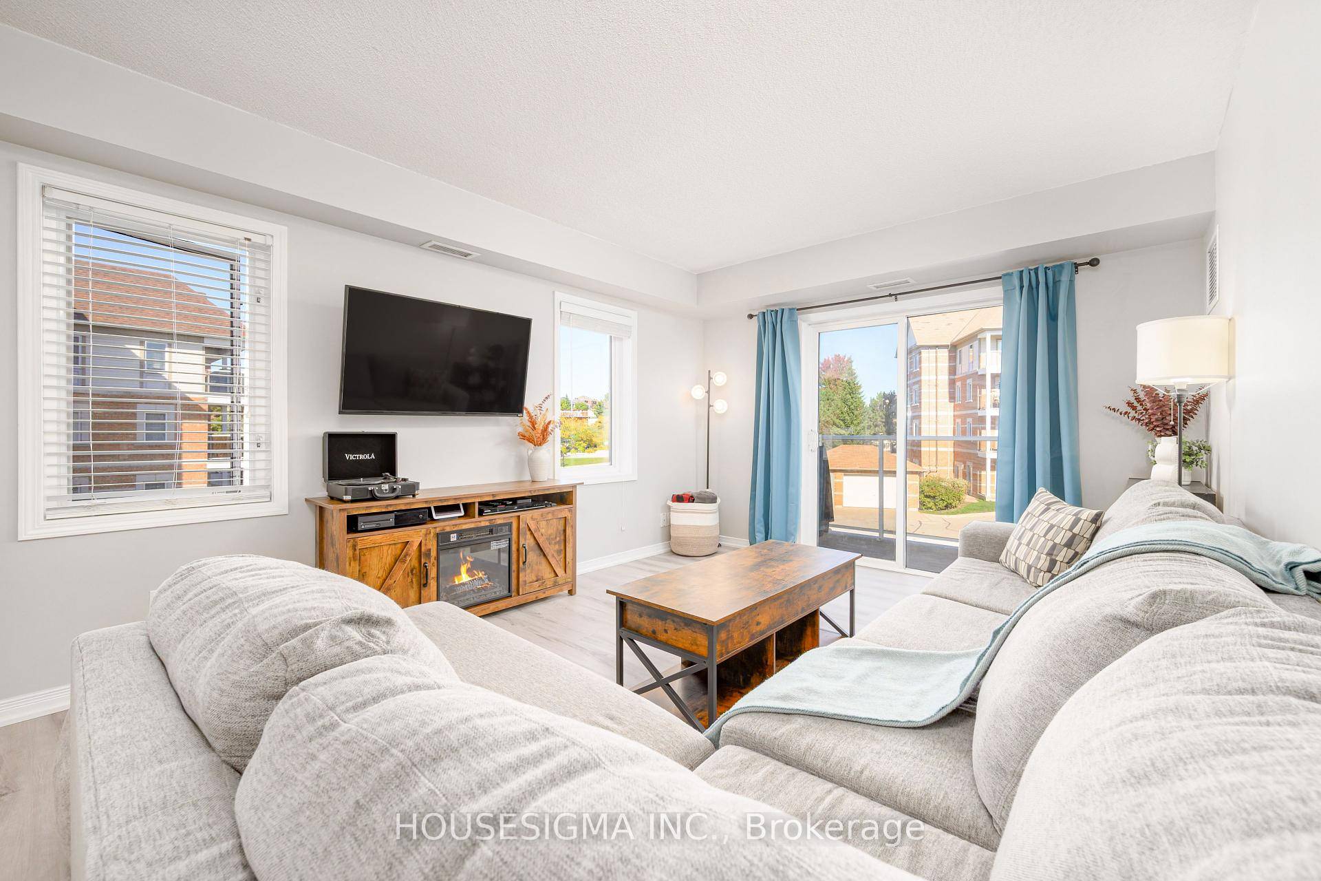 Welcome to Unit 206 at 136 Aspen Springs Drive, a bright corner suite in a low rise community near the lake and everyday amenities.