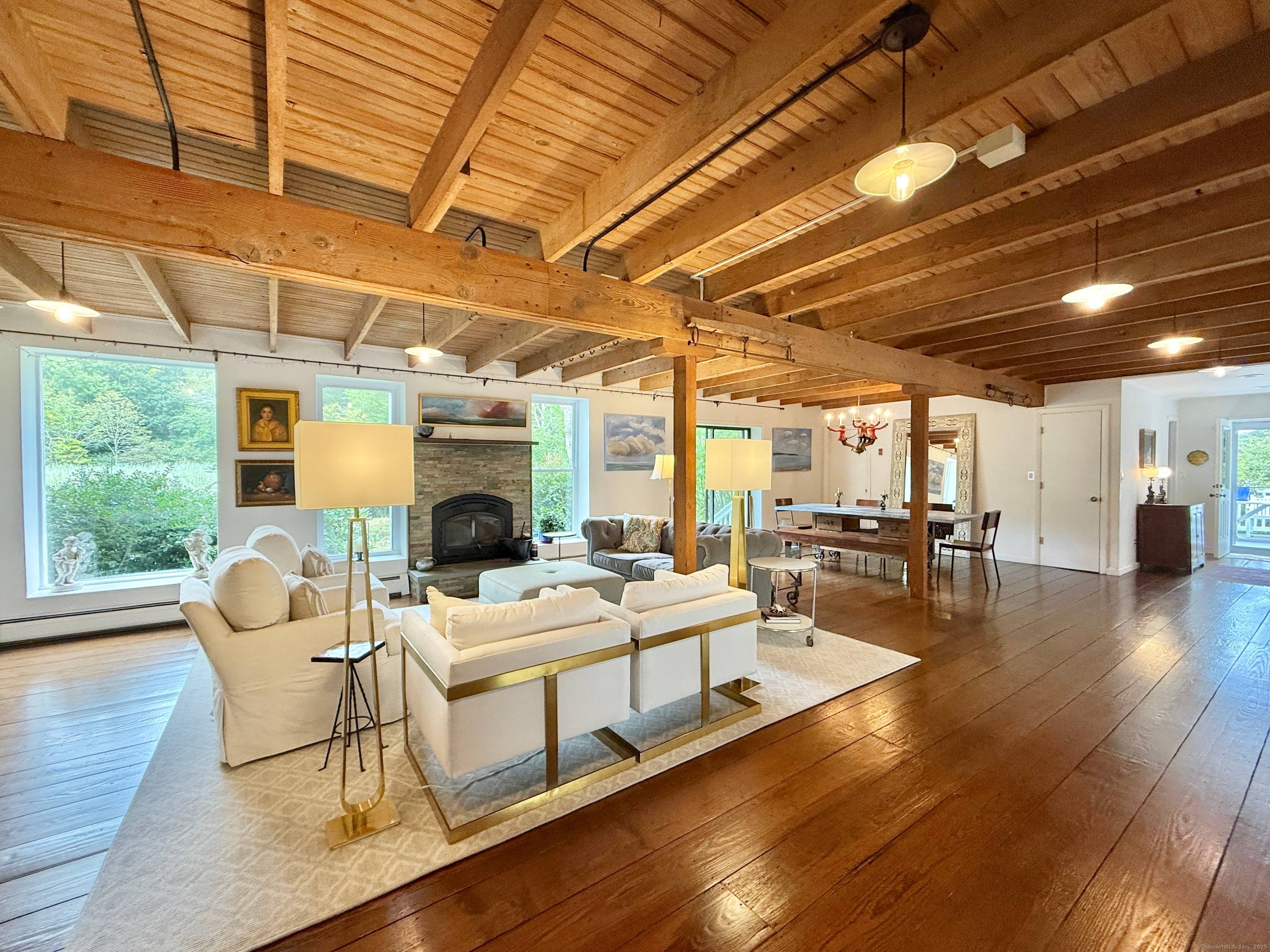 Rich architectural details, modern amenities and water views create a captivating atmosphere in this 1910 renovated barn.