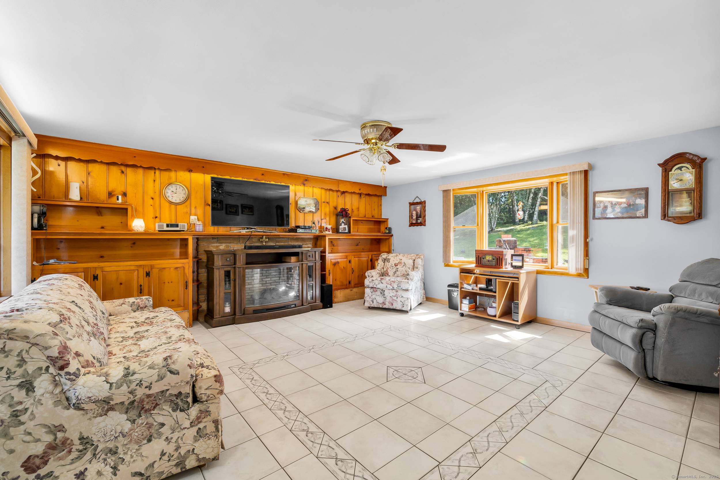 Spacious, sunlit, and set on a private stretch of Mattatuck Road, this charming Bristol ranch offers single floor living with bonus finished space below.