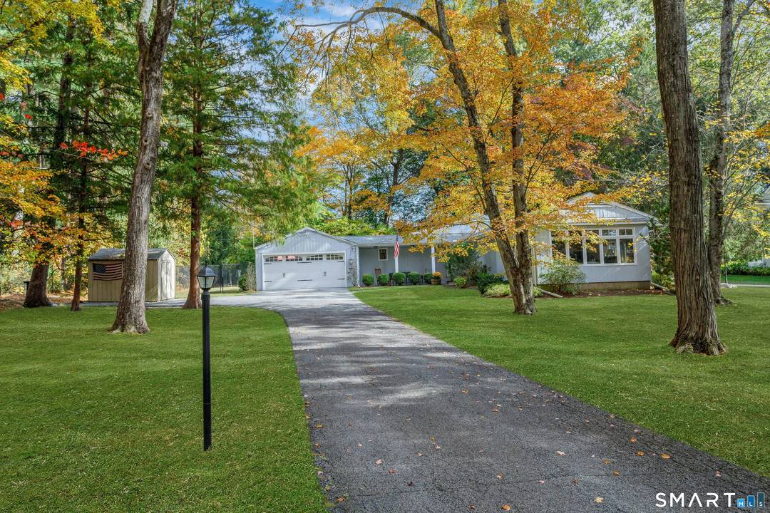 Lovely Ranch set peacefully on one level acre on a lower North Stamford cul de sac.
