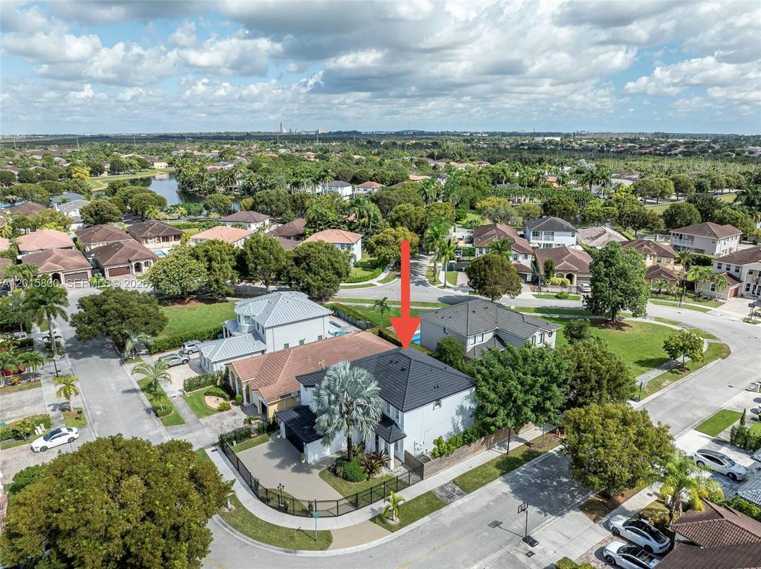 Discover the beauty of South Florida living in this stunning 2004 Mediterranean pool home, privately tucked away on a rare corner lot beside a peaceful private park.