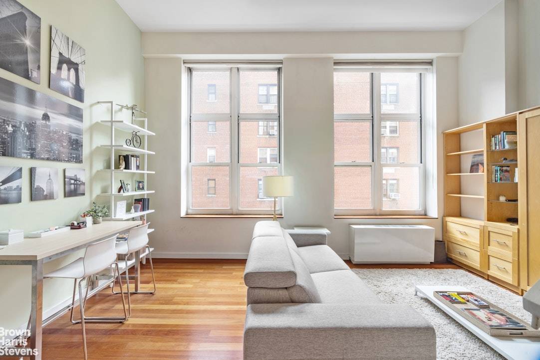 THE CHARM OF A LOFT, THE ELEGANCE OF PARK AVENUE COURT A dramatic duplex one bedroom home with double height ceilings and enormous south facing windows, providing wonderful light.