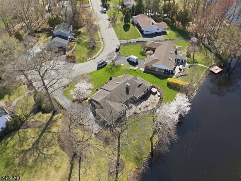 Welcome to your private lakefront retreat on Edgewater Lake, where breathtaking year round views set the tone for this beautifully maintained sprawling ranch.