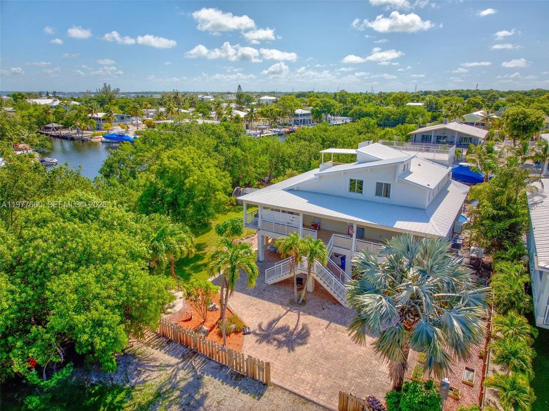 UPDATES 3 15 26 Freshly painted exterior, new pergola for relaxing on the dock, new fence, and new pool heater chiller.