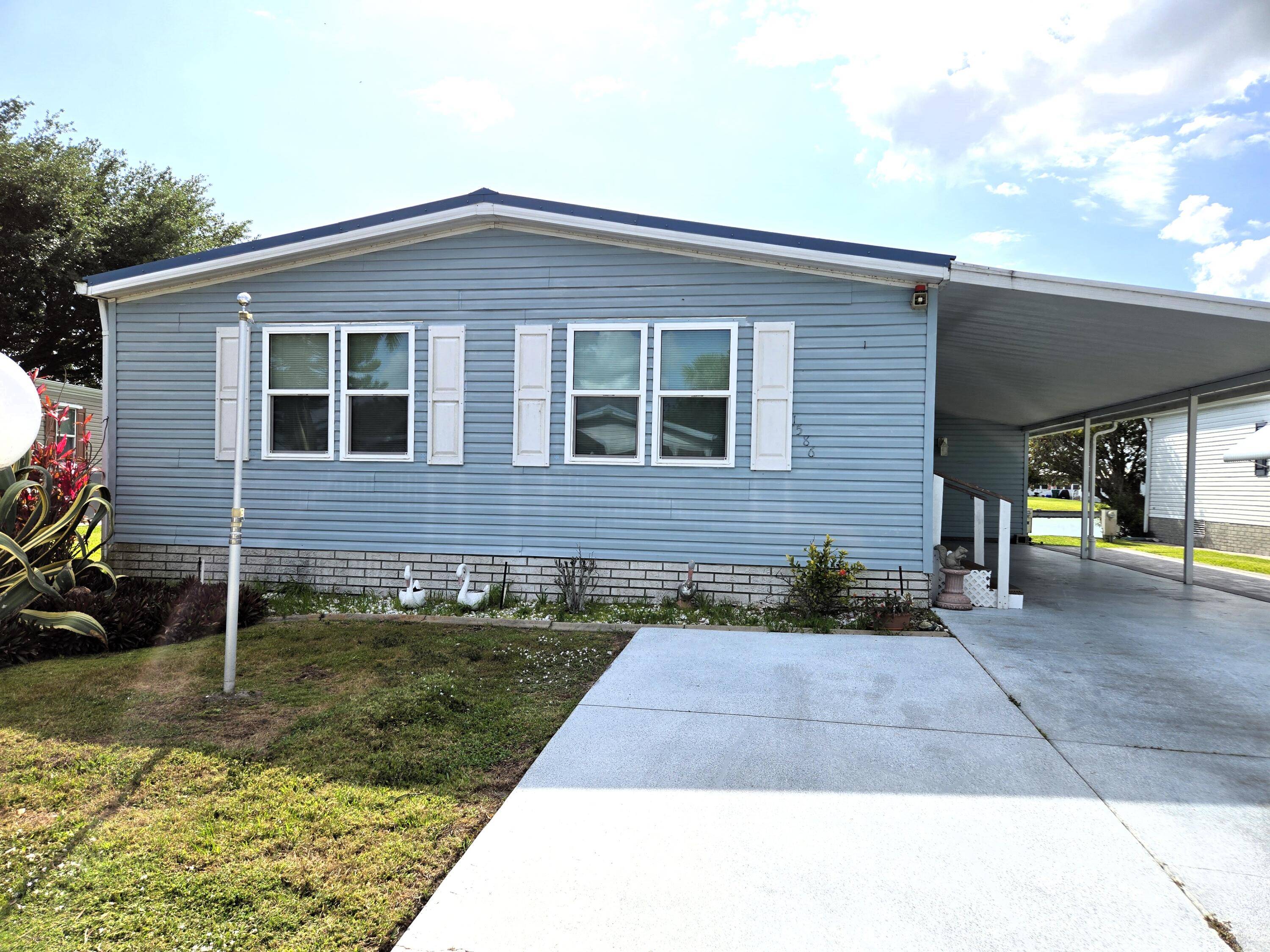 SEMINOLE COVE WATERFRONT DWMH with 1, 296 sf under air 1, 872 sf total lvg.