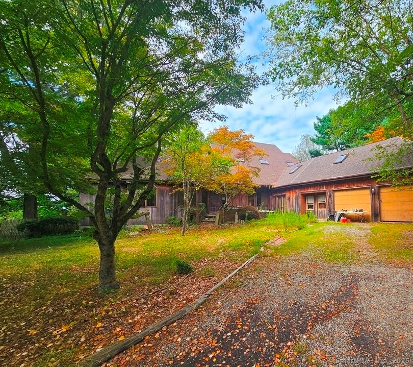 Welcome to this stunning contemporary residence set on a private, tree lined one acre lot.