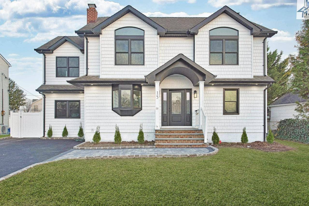 Welcome to Hicksville ! Discover this beautifully renovated, legal mother daughter home with proper permits in place.