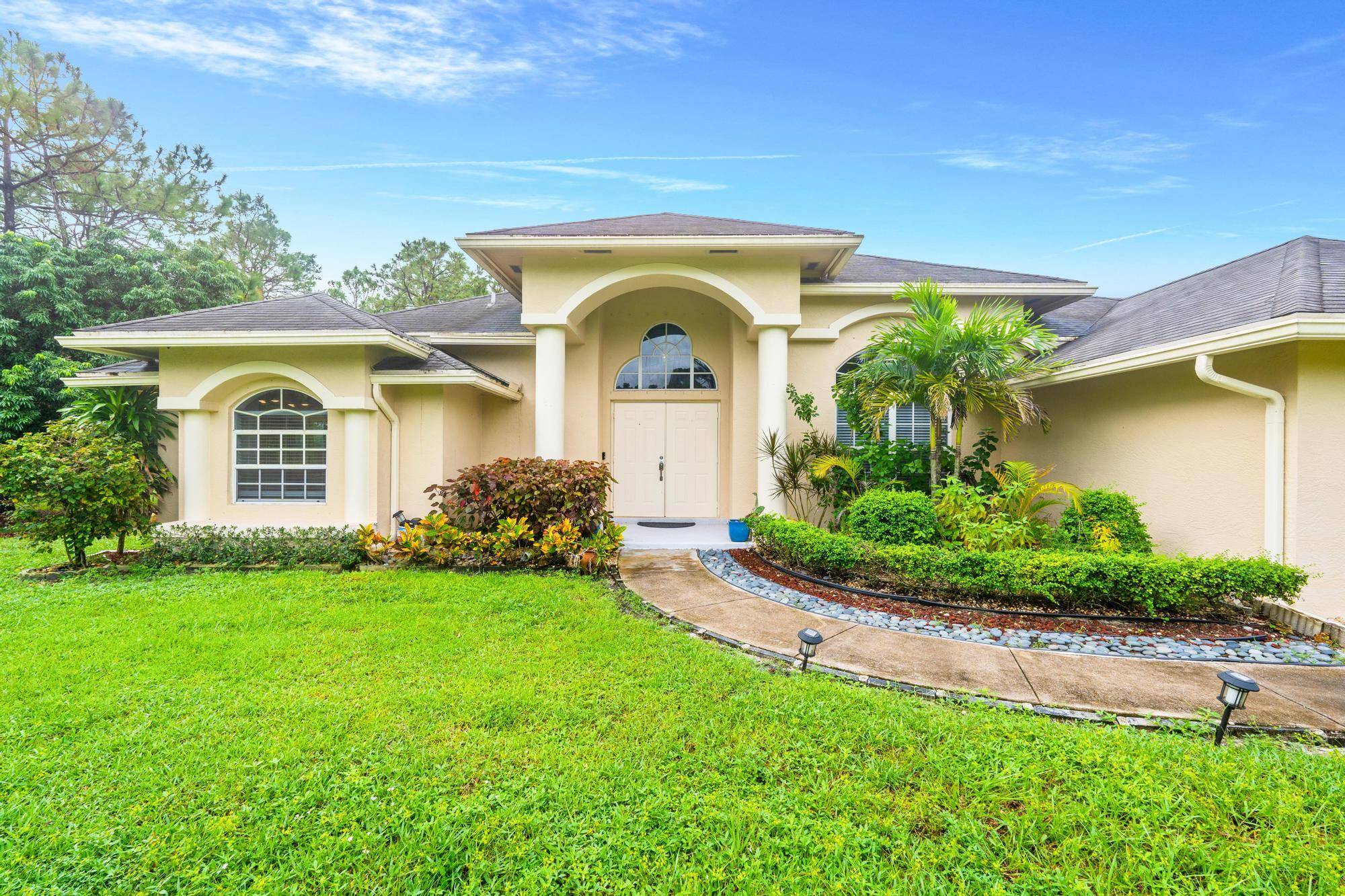 Welcome to a peaceful 5 acre retreat in the prestigious, gated community of Homeland.