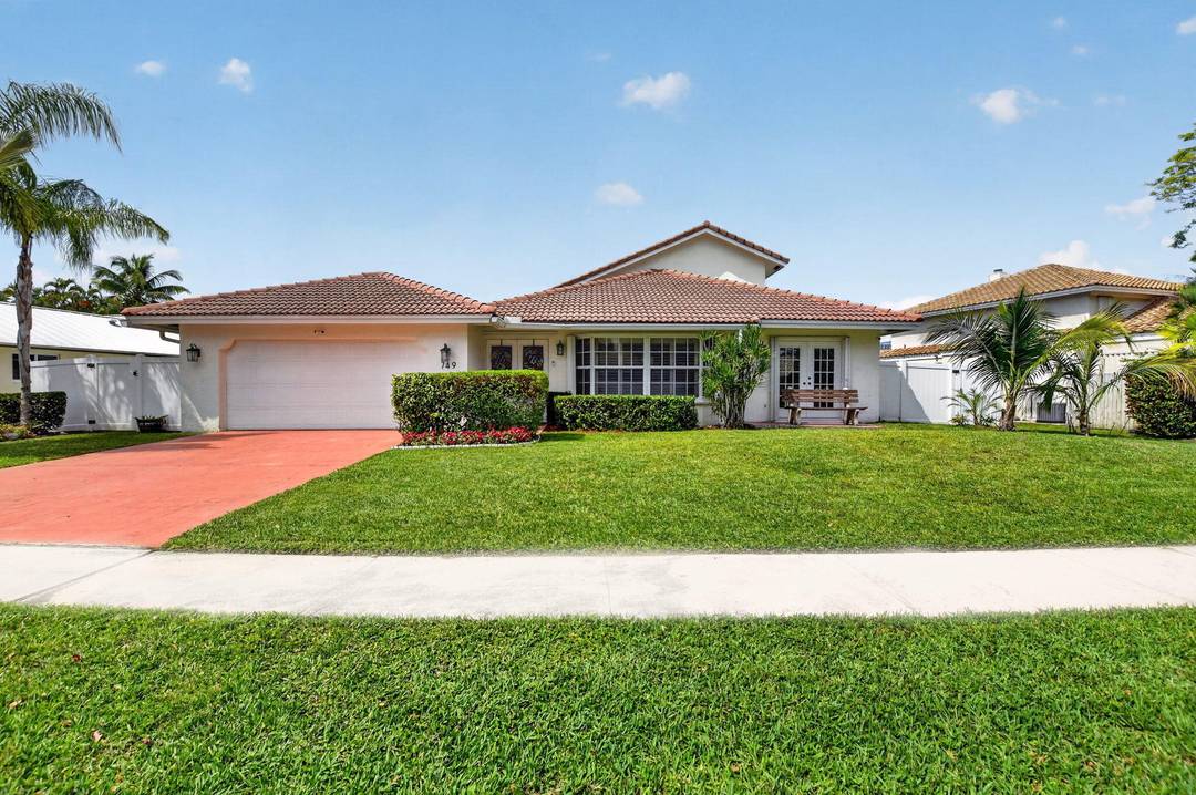 WOW What a view ! This light filled lakefront pool home offers 4 bedrooms plus den, 3.