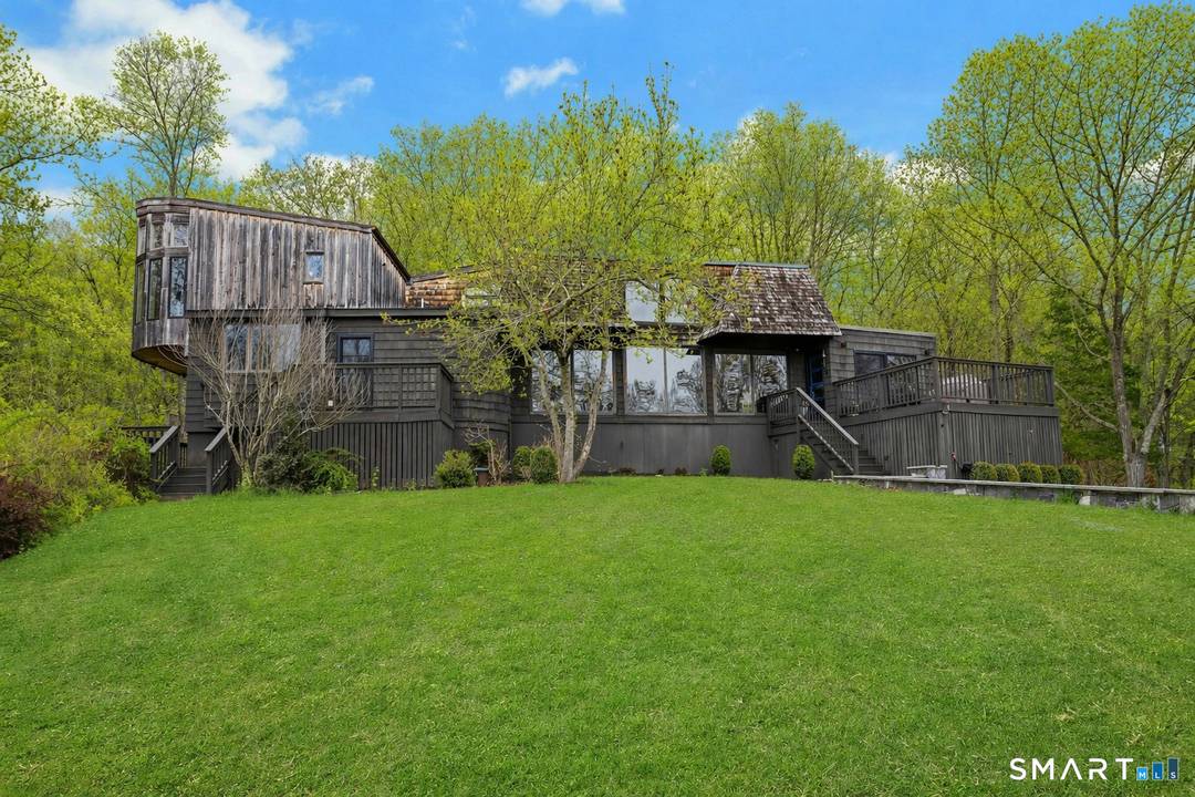 Perched atop 2. 12 acres at the end of a quiet cul de sac, this fully renovated modern 3BR contemporary offers a rare blend of privacy, architectural drama, and seamless ...