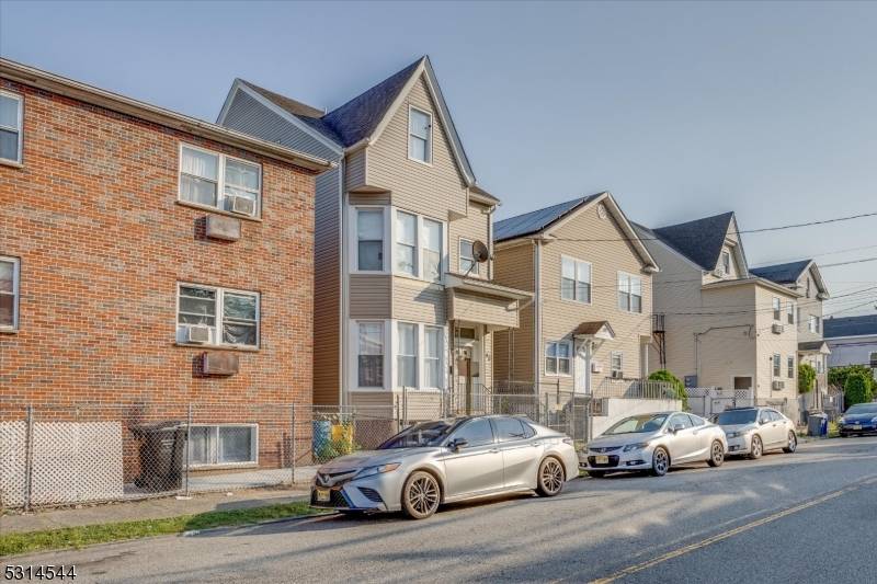 Don't miss this excellent opportunity to either live in and collect rent or invest in a solid legal three family home.