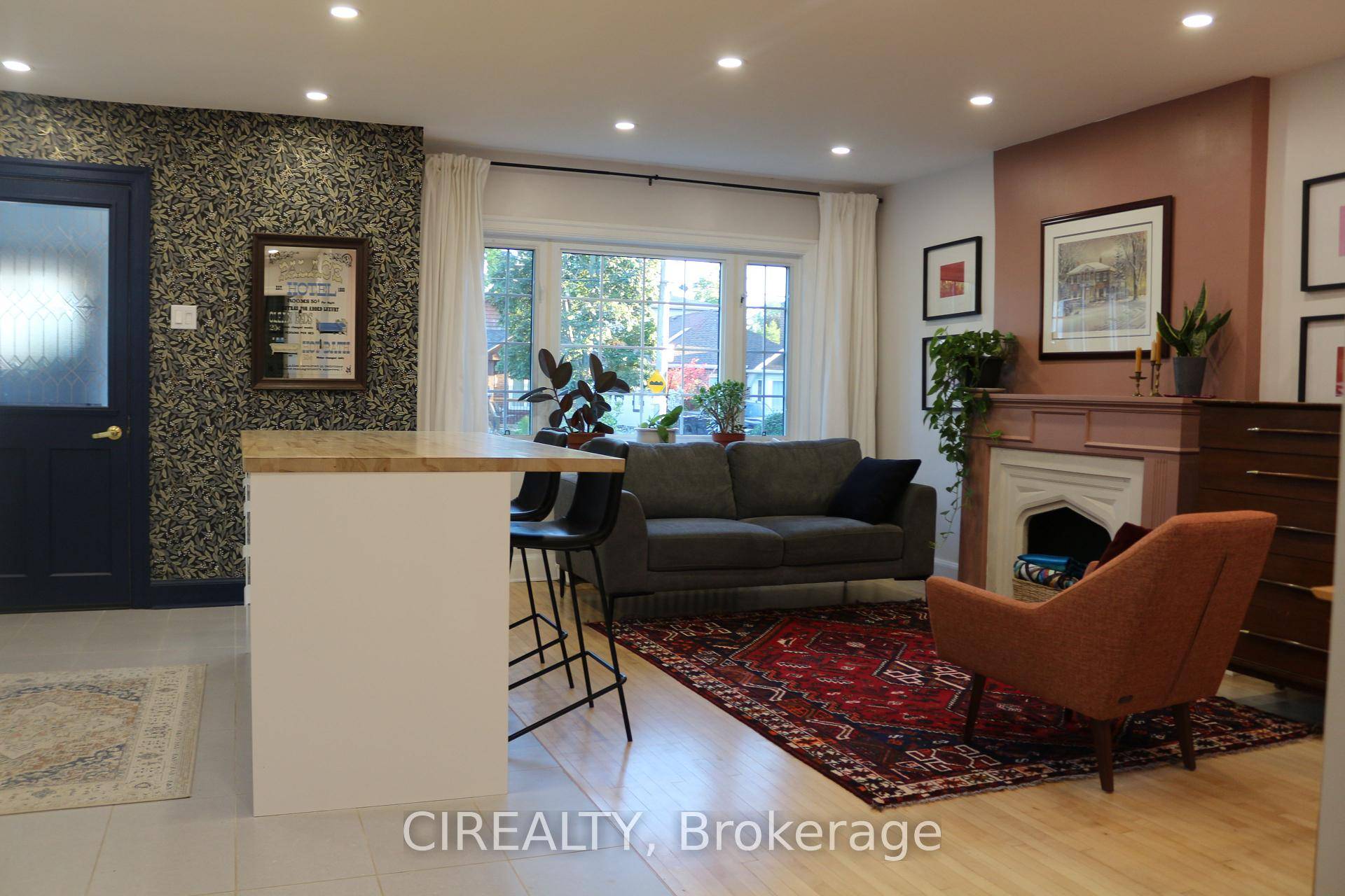 Nestled on a deep, sun soaked south facing lot, this delightful 2 1 bedroom, 2 bath brick stucco bungalow with a detached garage offers a serene, cottage like feel in ...